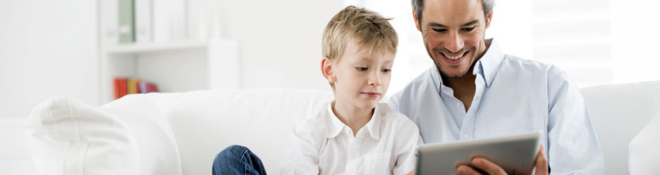 father and son using a tablet